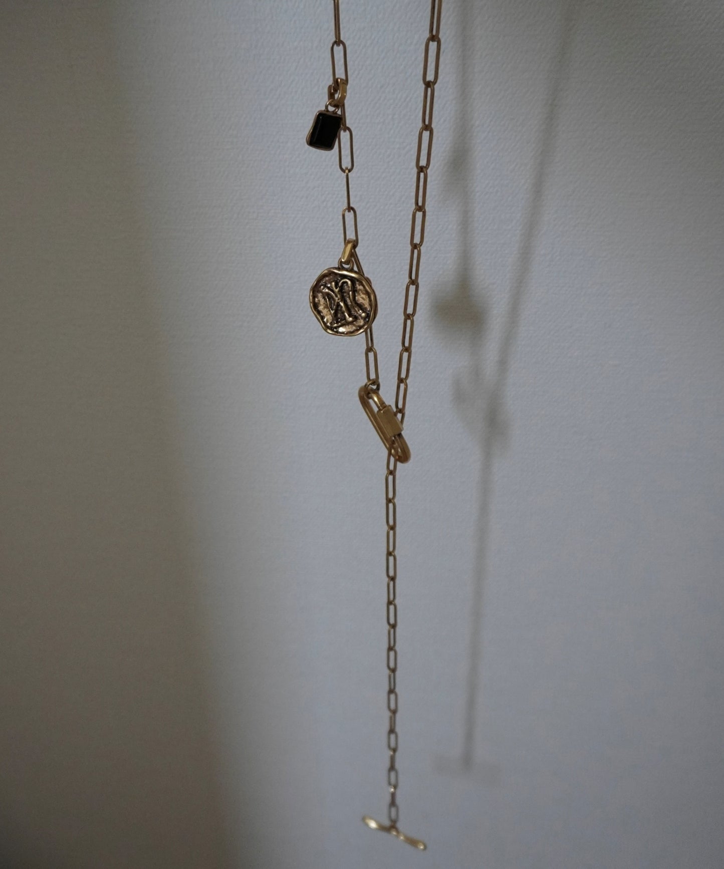 Coin charm tie