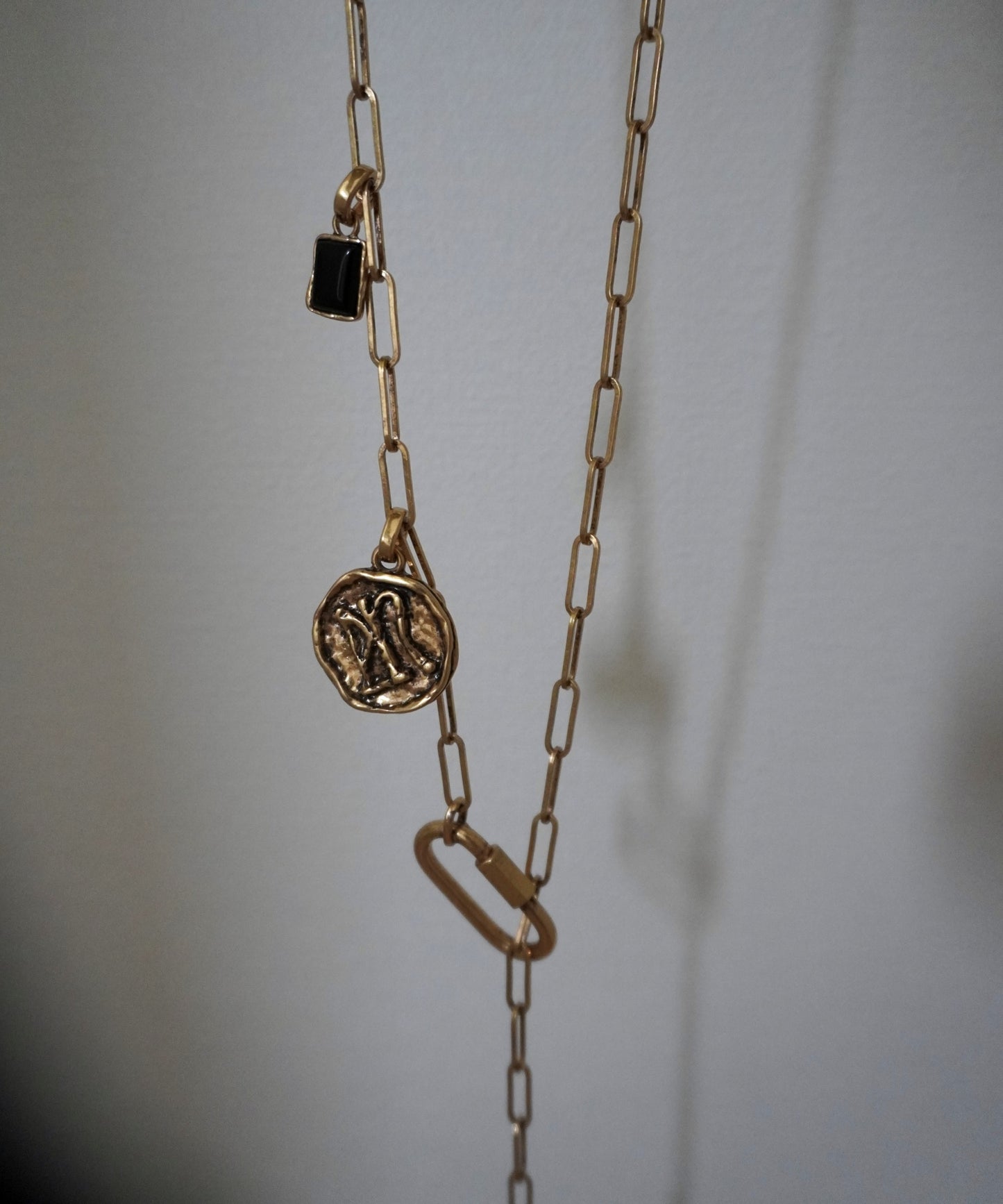Coin charm tie
